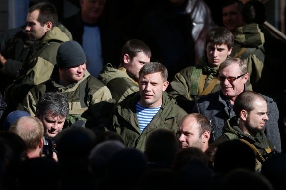 'Donetsk militia commander and prime minister of the ‘Donetsk People’s Republic’ Alexander Zakharchenko, center, visits a coal mine October 29 as he campaigns to be elected head of state. (Reuters/Maxim Zmeyev) '